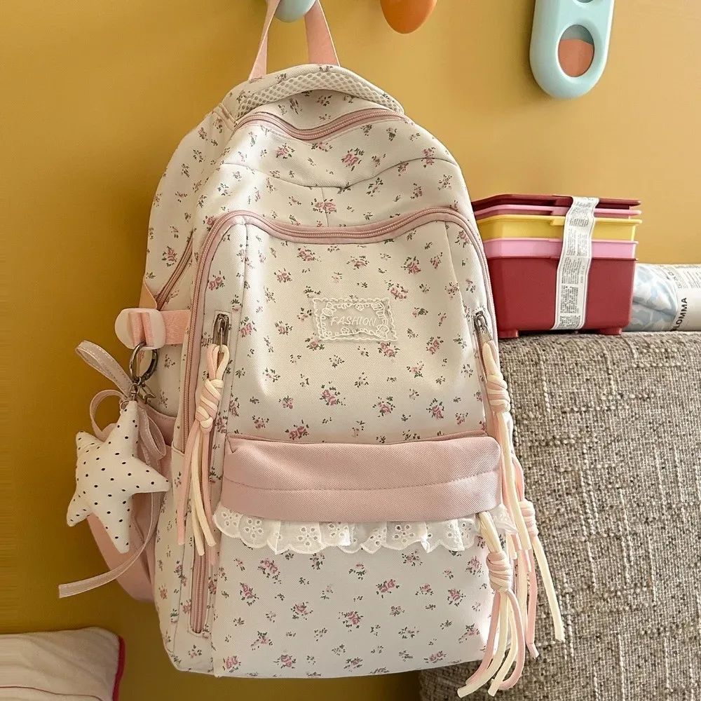 sac à dos à imprimé floral avec décor en dentelle, ultra léger, avec pendentif étoile, esthétique fraîche, grande capacité, idéal pour les trajets quotidiens.