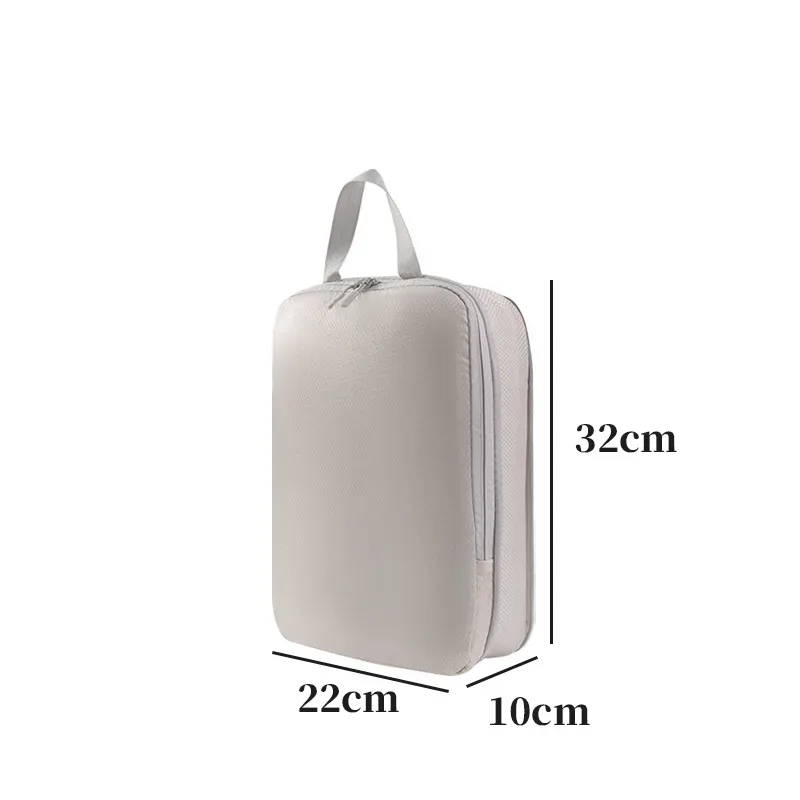 organisateur voyage polyester blanc bandes grises format rectangulaire poignées grises compression vêtements articles toilette rangement valise