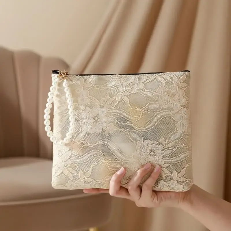 pochette cosmétique en dentelle avec sangle de poignet en perles et design semi-transparent, idéale pour le rangement quotidien du maquillage et les voyages