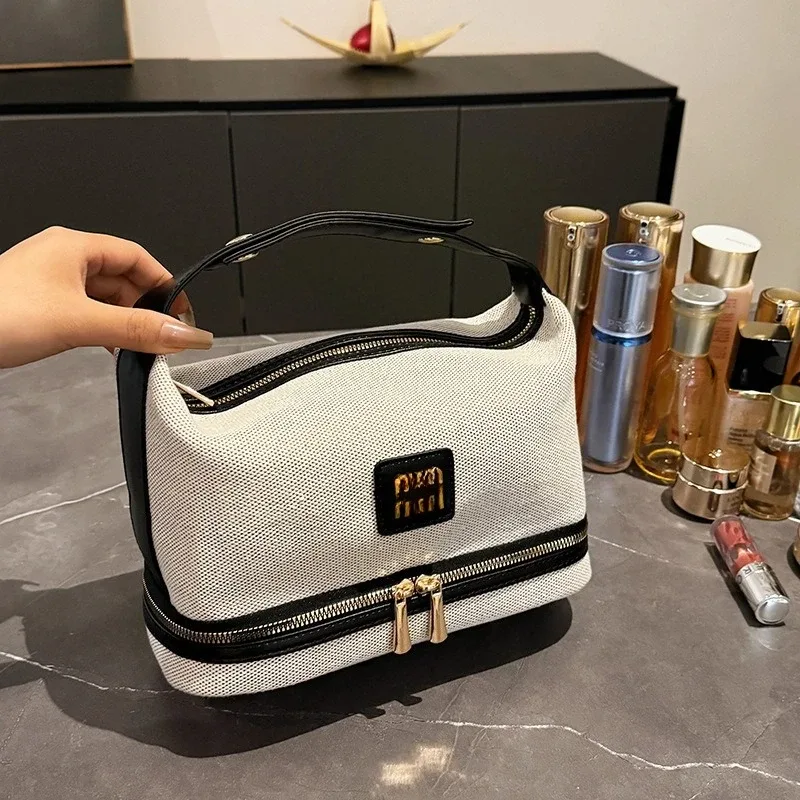nouvelle trousse de maquillage portable en toile rétro de luxe avec étiquette métallique, de haute qualité et multifonctionnelle, idéale pour les voyages.