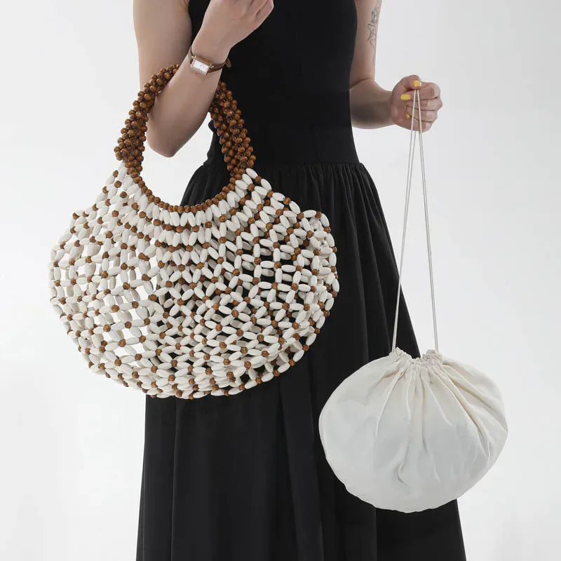 sac à main féminin fait main en perles, sac de plage tissé pour femmes, design exquis, sac seau creux en perles de bois, sac à bandoulière.