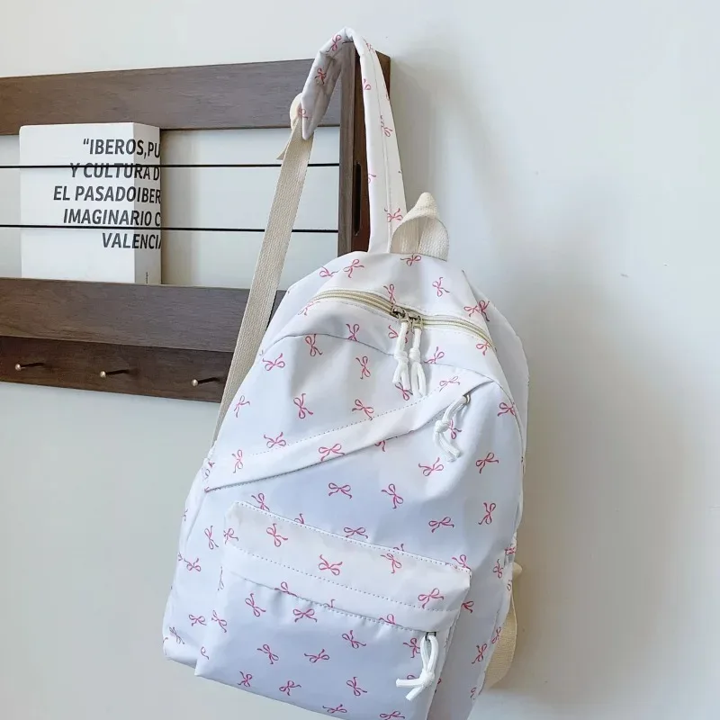 sac à dos tendance et mignon à imprimé nœud pour femme, compartiment pour ordinateur portable avec bretelles réglables, sac idéal pour la rentrée scolaire et les voyages sur le campus