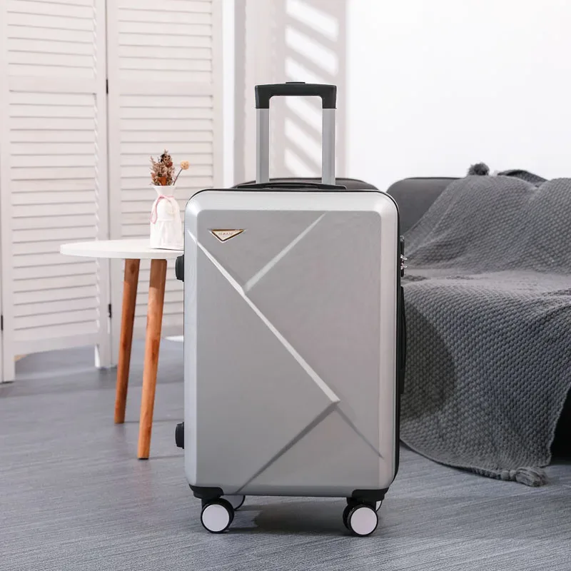 valise abs plastique dur motif géométrique lignes diagonales relief gris rose blanc jaune vert bleu rouge bagage affaires voyage