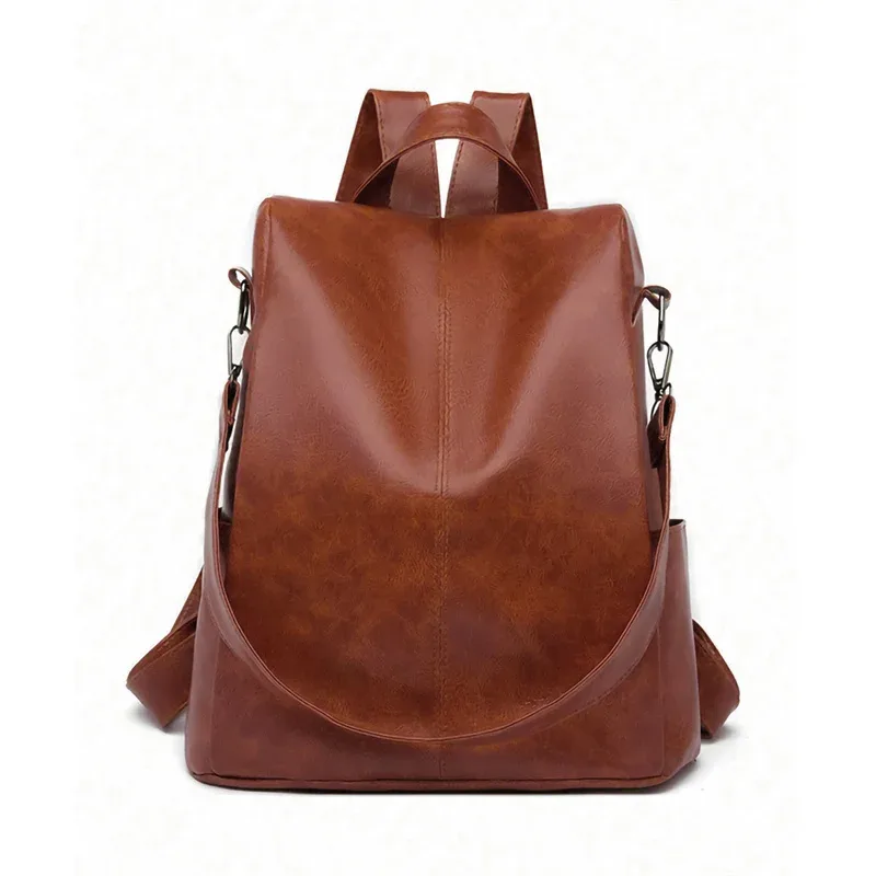 sac dos cuir matériau similaire marron clair texture grunge forme trapézoïdale poignées latérales sangle ajustable voyage femme