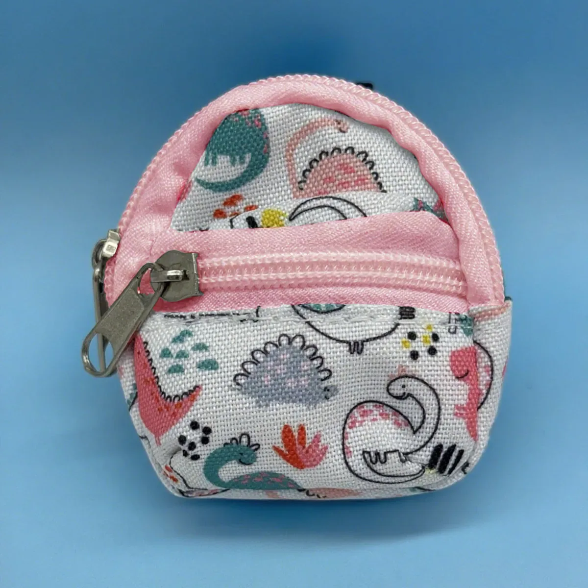 sac dos nylon petit format ovale fermeture glissière poche latérale double épaule poches latérales couleur vivante usage voyage
