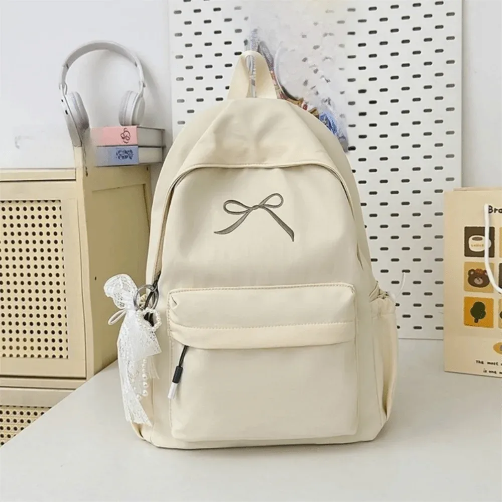 sac à dos portable avec nœud brodé pour filles, cartable en nylon de couleur unie pour étudiants, sac à dos de voyage léger de grande capacité