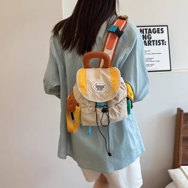 sac dos oxford cloth toile patchwork alphabet décontracté pompon bandoulière arquée anti-vol respirant usage idation voyager école pleinair