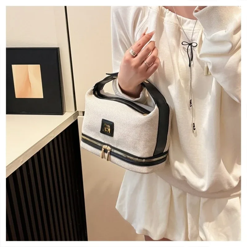 nouvelle trousse de maquillage portable en toile rétro de luxe avec étiquette métallique, de haute qualité et multifonctionnelle, idéale pour les voyages.