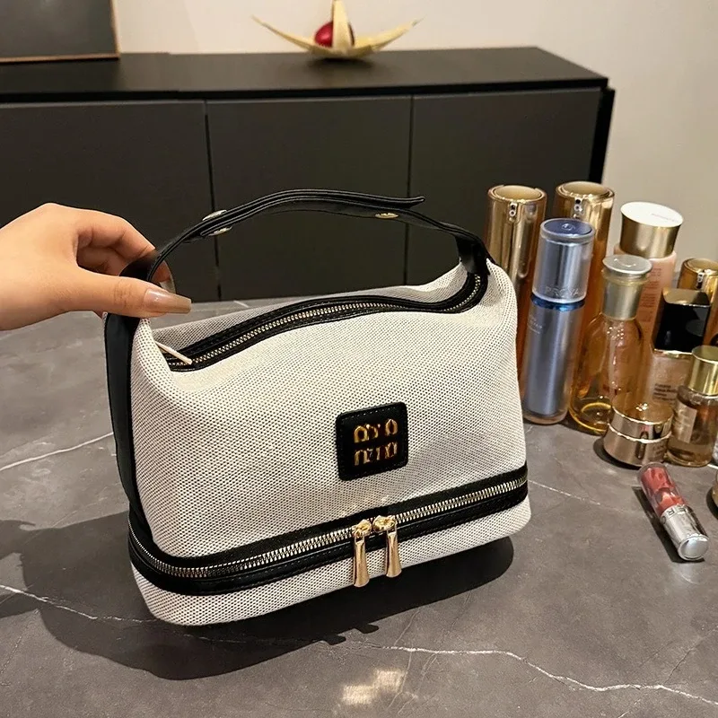 nouvelle trousse de maquillage portable en toile rétro de luxe avec étiquette métallique, de haute qualité et multifonctionnelle, idéale pour les voyages.