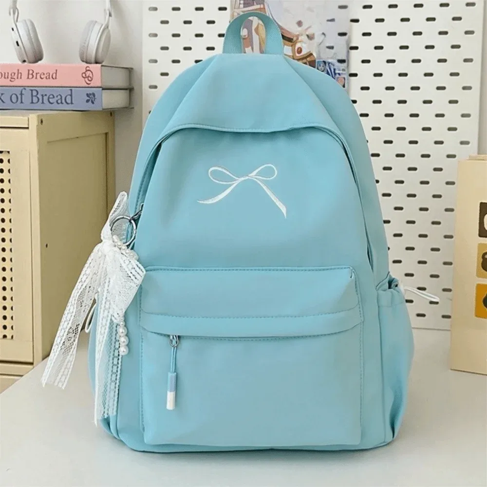 sac à dos portable avec nœud brodé pour filles, cartable en nylon de couleur unie pour étudiants, sac à dos de voyage léger de grande capacité