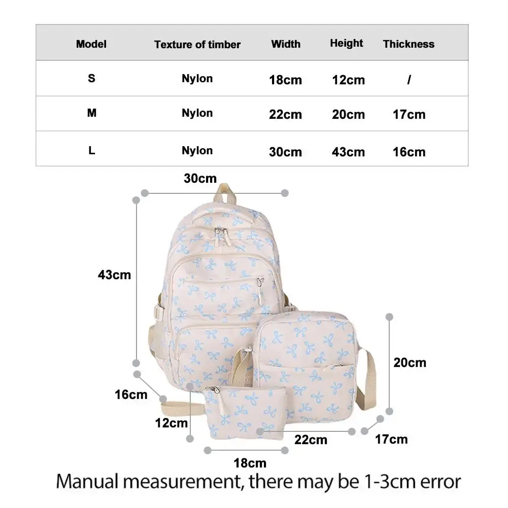 sac dos polyester motifs nœuds blancs fond noir beige deux petits sacs accessoires usage voyage école
